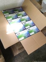 Open case showing 10 boxes of nitrile gloves labeled Microflex Ultraform Medium size