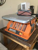 Front view of Ridgid sander showing belt sander and work table