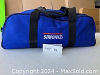 Closed blue Simoniz branded bag showing the exterior and branding.