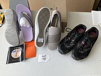 Top and bottom of purple Vionic flip-flops with care cards alongside other shoes