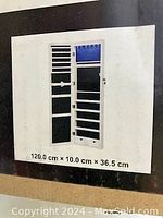 Closed cabinet schematic drawing showing dimensions (120 x 10 x 36.5 cm) and basic design for wall-mounting or door-hanging installation.