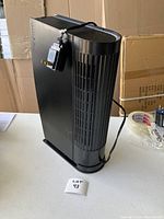 Oreck air purifier tower fan showing side panel and power cord