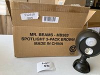 Cardboard box with label showing Mr. Beams MB363 Spotlight 3-Pack Brown, made in China.