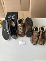 Three pairs of shoes: Naturalizer shoes, tan leather sandals, brown hiking shoes, shown with soles and box