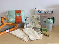 Overview of household linens, hangers, foam and shaker