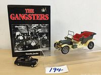 The Gangsters book with two vintage car models