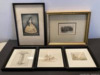 Five framed art pieces arranged together showing variety in subjects and framing styles