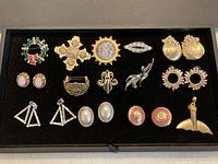 Full view of all vintage costume jewelry in black case.