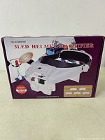 Box of 3 LED helmet magnifier showing product image and text.