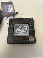 Pixel Flash Hyper Core 3600X 256GB memory card on black circuit board patterned display box with PF branding and attached tag.