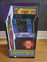 Front of sealed box showing Centipede arcade cabinet artwork and marquee
