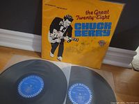 Yellow album cover with Chuck Berry playing guitar, titled The Great Twenty-Eight, showing some wear and discoloration.