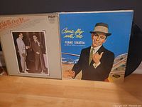 Photo showing front covers of the 2LP set 'I'm Gettin' Sentimental Over Tommy Dorsey and His Orchestra' and 'Come Fly With Me' by Frank Sinatra.