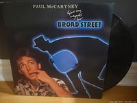 Front cover of Paul McCartney Give My Regards to Broad Street LP showing vocalist and shadow figure with album name.
