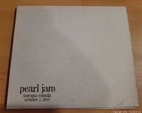 Front cover of Pearl Jam Live In Toronto CD, beige case with black text showing date and location of concert.