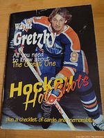 Front cover of the Wayne Gretzky Hockey Hot Shots book showing Wayne Gretzky in Edmonton Oilers uniform with text and title on cover.