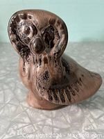 Front view of Blue Mountain Pottery owl figurine showing detailed mocha glaze and stylized owl face.