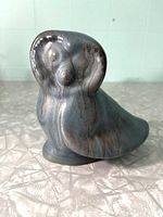 Front view of Blue Mountain Pottery owl figurine highlighting facial features and colors.