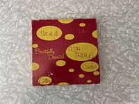 Original red and yellow polka dot box labeled 'Set of 4 beautifully decorated ash trays coasters Cutler'