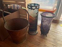 Wide shot of all three items on wooden floor near window, showing full view and scale