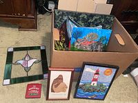 Box containing all items: stained glass panel, two paintings, wood craft, wool art, chromatic pitch instrument in box