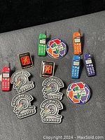 Full assortment of retro Nokia pins including colorful cell phones, circular Nokia 50-1400 logos, Pritech business logo pins, and Nokia Way 1993 quality pins.