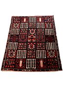 Full top view of the rectangular rug showing the overall brick style/tile pattern with dark colours and multiple motifs.