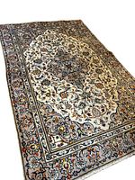 Angled full view of rug on white background showing overall design and colors