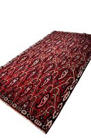 Angled full view of red cedar motif rug