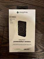 Front view of the Mophie Charge Stream Powerstation Wireless packaging showing product name, image, and compatibility with wireless charging.