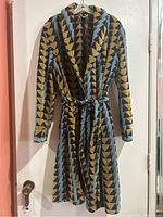 Full front view of the retro patterned robe hanging on door, showing the overall geometric design and belt.