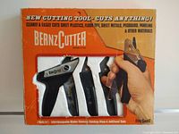 Front of the box showing the BernzCutter cutting tool and blades with product claims and features.