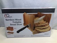 Box of new Dobtech Bamboo Wood Foldable Bread Slicer showing product image and features.