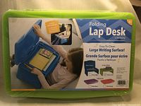 Packaging showing the product features and a child using the lap desk with school supplies inside.