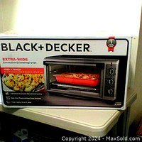 Box of Black + Decker extra-wide convection countertop oven showing product image and branding