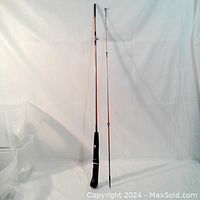Full view of the 5.6 ft spin cast fishing rod showing the full length and black handle.