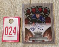 Front view of the 2010-11 Panini Crown Royale Rookie Autograph Kyle Clifford card in protective sleeve next to a numbered tag 024