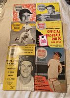 Six Baseball Digest magazines from 1940s and 1950s laid out on surface, showing various cover players and baseball themes.