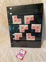 Black album page with multiple blocks of Canada Postage Due stamps from 1969-77 showing denominations 12, 10, 3, 8, and 9 cents.