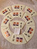 Photo showing the full set of 10 fan-shaped souvenir sheets arranged in a circle, each with two stamps.