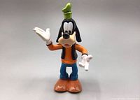 Front view of the vintage Disney Goofy mini action figure showing the detailed face, hat, and outfit.