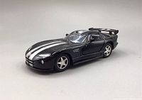 Black 1:36 scale Kinsmart Dodge Viper GTS-R diecast model car angled left view showing front and side with silver racing stripes and rear spoiler.