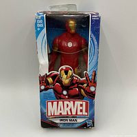 Photo of the Marvel Iron Man action figure in original box showing packaging wear and figure inside.