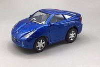 Front and side view of metallic blue Toyota Celica diecast model car showing detailed exterior and wheels