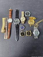 Overview of all 10 watches and watch bands laid out against dark background showing various styles and sizes