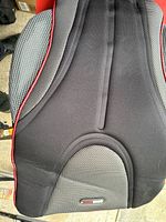 Top view of the ObusForme heated massage cushion showing contoured backrest with mesh and fabric sections.