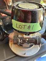 Photo of the router showing its mechanical speed control on top with a tape labeled LOT#1.