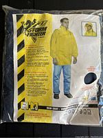 Front packaging showing a yellow Storm Fighter rain jacket with features and a model wearing it along with comfort lining preview.