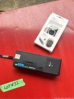 Keystone XR308 camera on red surface with lot sticker