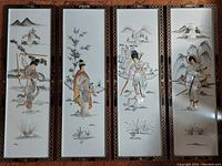 Four vertical handcrafted shell art panels depicting warrior women in traditional Chinese dress, framed by carved wood borders.